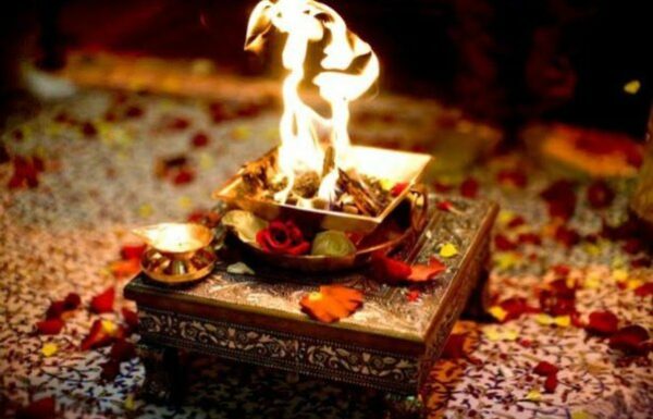 Agni Hotra fire burning in a brass kund